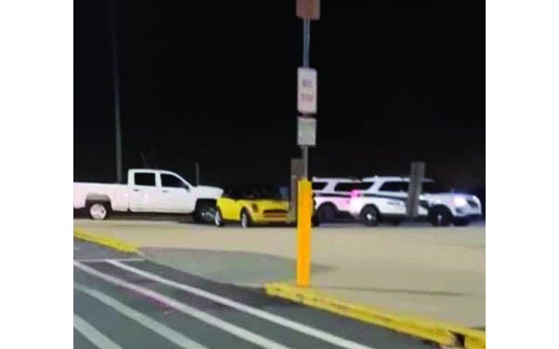 Photo submitted A video from the incident shows the yellow Mini driven by Ledford surrounded by police cars. 