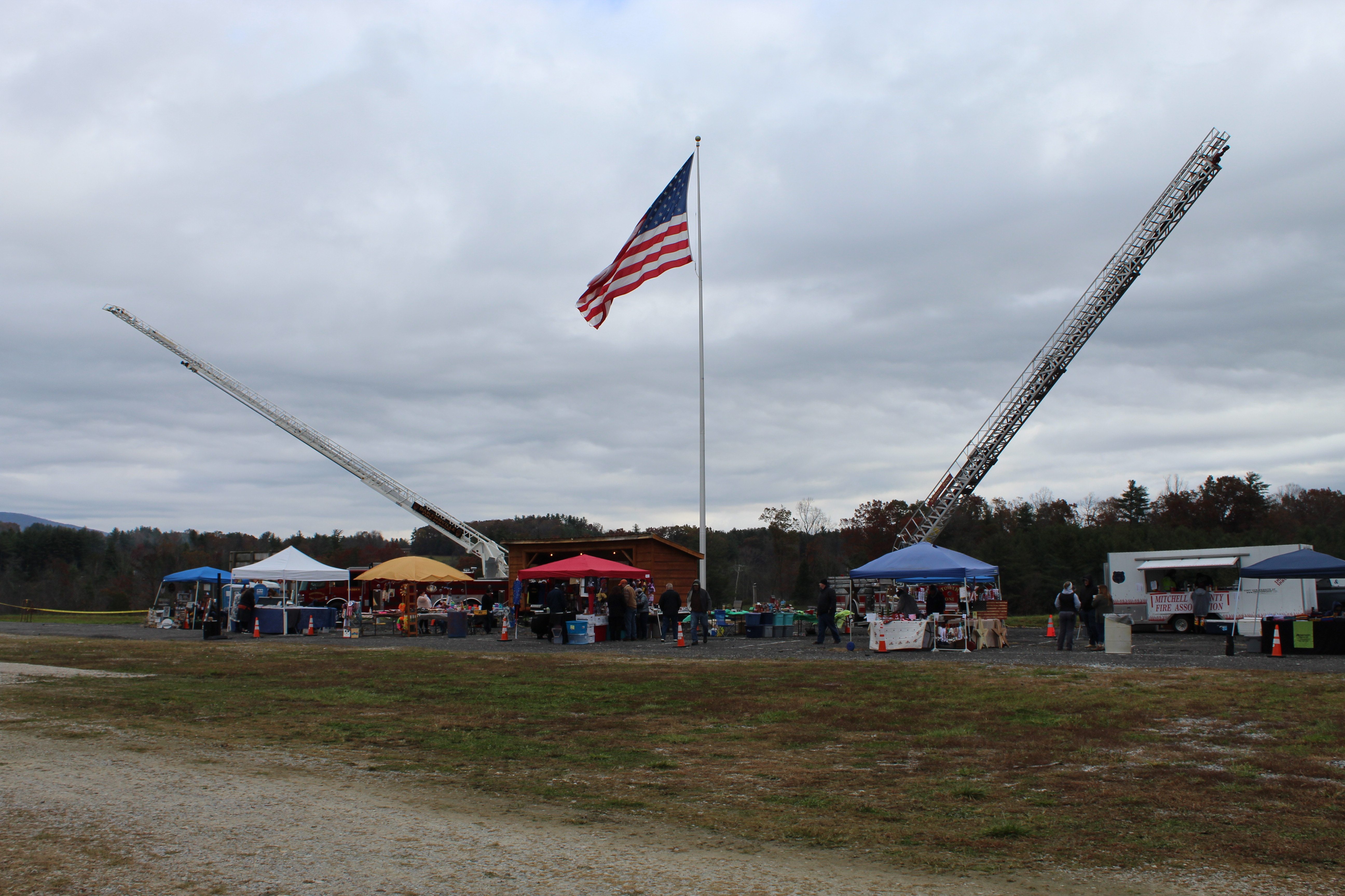 A large United States flag flies in overcast skies over the second annual Remember When Day. (MNJ Photo/Juliana Walker)