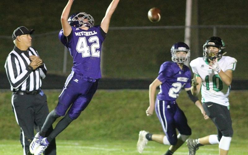 Mitchell High School junior varsity football player Gabe Brandt (No. 42) attempts to deflect a pass to a Mountain Heritage receiver being defended by Mitchell's Gage Young Thursday, Oct. 17, during the JV Mountaineers' 32-14 loss to rival Mountain Heritage in Ledger. (MNJ photo/Cory Spiers)