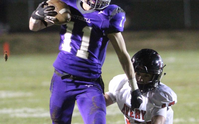Mitchell senior Garrison Phillips takes a pass 66 yards for a touchdown Friday, Nov. 8, during the Mountaineers’ 51-6 win over the Avery Vikings in Ledger. Phillips led Mitchell’s receivers with five catches for 107 yards and a touchdown. (Brandon Roberts/MNJ)