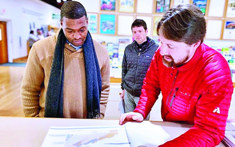 North Carolina Department of Environmental Quality Secretary Michael Regan listens to staff from the North Carolina Geological Survey talk about landslide mapping capabilities Thursday, Nov. 14, at the Museum of North Carolina Minerals in Spruce Pine. (Submitted)