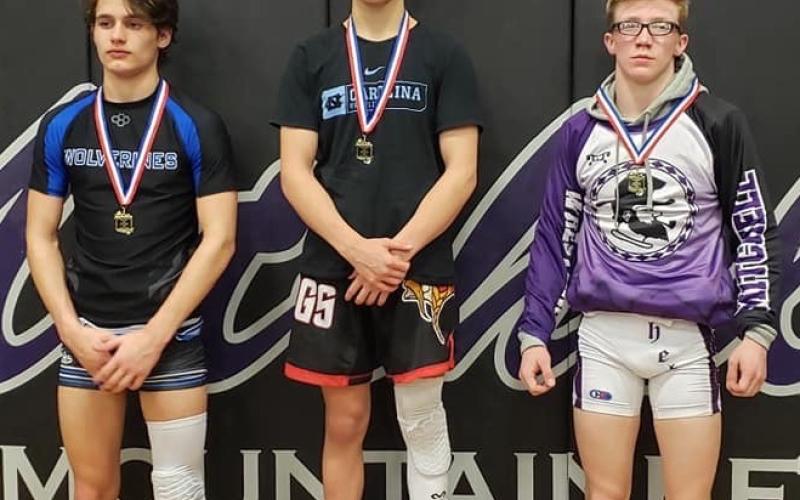Mitchell senior Dylan Lowery, right, earned a second-place finish in the 120-pound weight class at the Western highlands Conference Tournament. (Submitted)