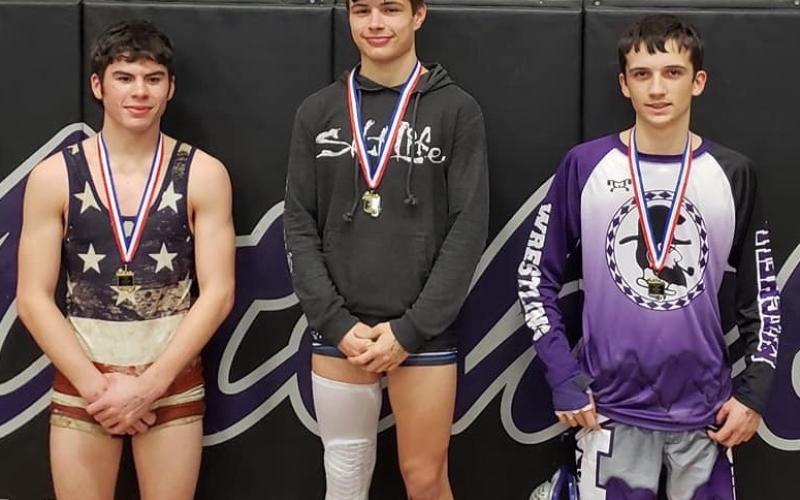 Mitchell senior Elijah Smith, right, earned a second-place finish in the 126-pound weight class at the Western highlands Conference Tournament. (Submitted)
