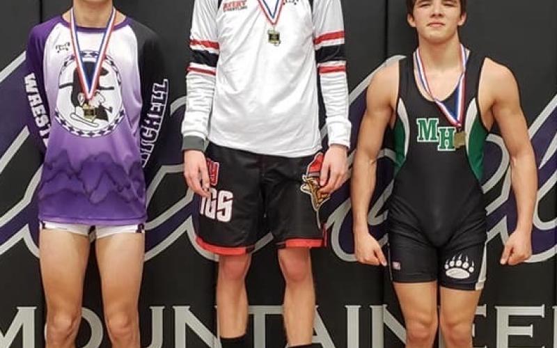Mitchell senior Seth Elsaesser, left, won third place in the 138-pound weight class at the Western highlands Conference Tournament. (Submitted)