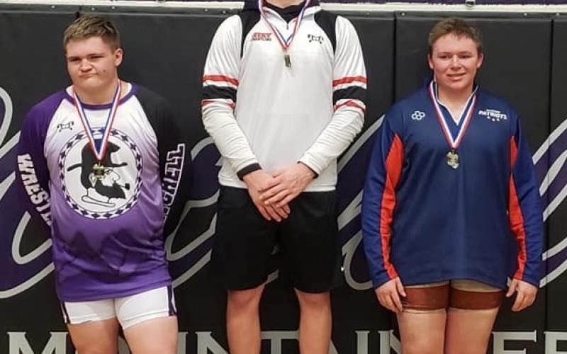 Mitchell senior Samuel Shook, left, won third place in the 220-pound weight class at the Western highlands Conference Tournament. (Submitted)