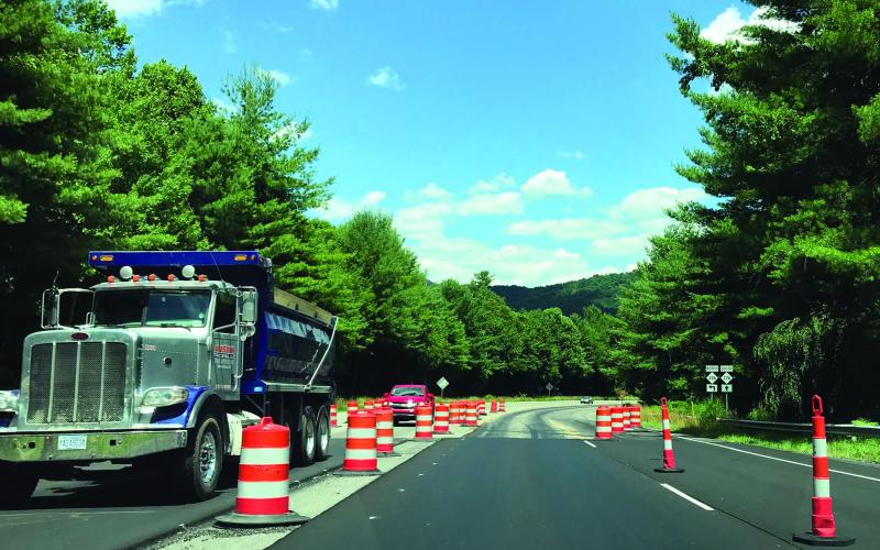 Traffic on U.S. 19E heading toward the Estatoe area merges into a single lane as cones block off some areas of the road. The project to widen the road from this point to Burnsville should be complete by the middle of September, an NCDOT official confirmed. (MNJ photo/Cory Spiers)