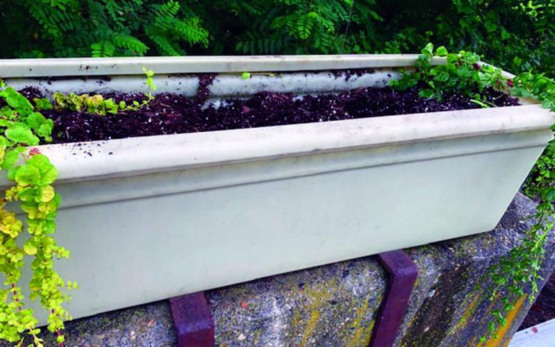 A decorative planter in Bakersville sits without flowers after being vandalized. (Submitted photo)
