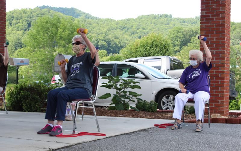 Seniors participate in an exercise class at the Mitchell County Senior Center. Pictured Left to Right: Mila Black and Kathleen Buchana. Photos by Juliana Walker/MNJ