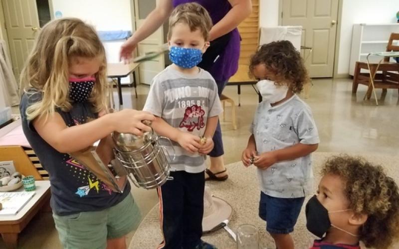 While kids are not required to wear masks at the daily summer camps, Head of Spruce Pine Montessori School Vick Austin said the kids, ages three to six-years-old, have grasped the concept very well. Pictured. Left to Right: Rowan, River, Jake and Nathan. (Photo submitted by SPMS)