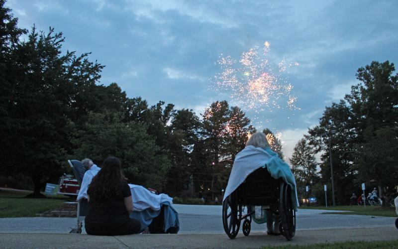 Brian Center residents cozy up with blankets as they watch a special fireworks show on Thursday, Aug. 20. Spruce Pine Police Chief Bill Summerlin raised funds to provide a show and ice cream for residents of the Brian Center and Mitchell House. (MNJ photo/Juliana Walker)
