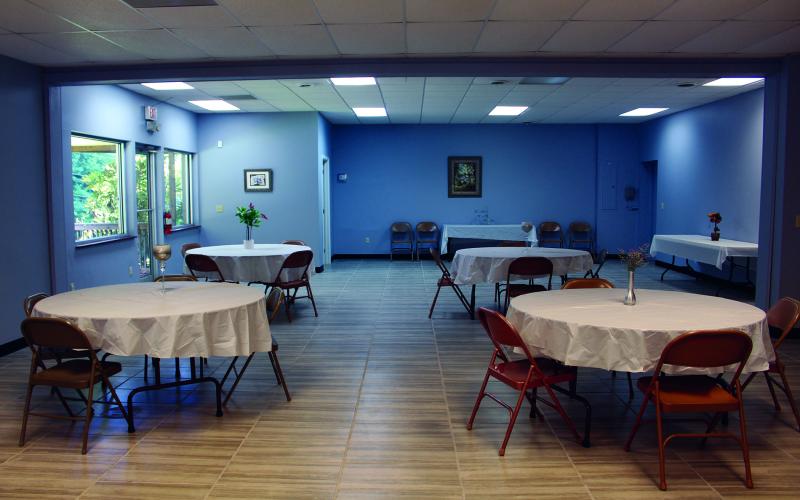 The inside of The Event Center sits ready for an event. The Event Center, which is located in Spruce Pine in the building that used to house Mountaineer Auction, offers a large space for parties, banquets and other events. (MNJ photo/Cory Spiers)