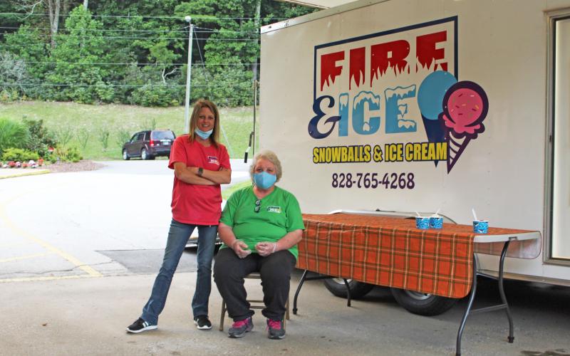 Employees of Fire &amp; Ice Snowballs &amp; Ice Cream sit ready for business at the Brian Center on Thursday, Aug. 20 during a special fireworks show for the seniors. (MNJ Photo/Juliana Walker)