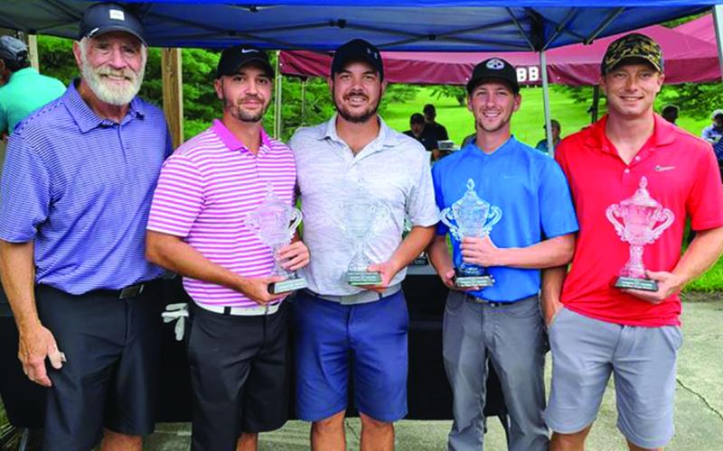 Billy Graham Evangelistic Association Executive Vice President Ken Karun with first flight tournament winners Lane Rosenfield, Neal Kepner, Alex Pittman and Nick Westmoreland. (Photo by Rocky Branch)