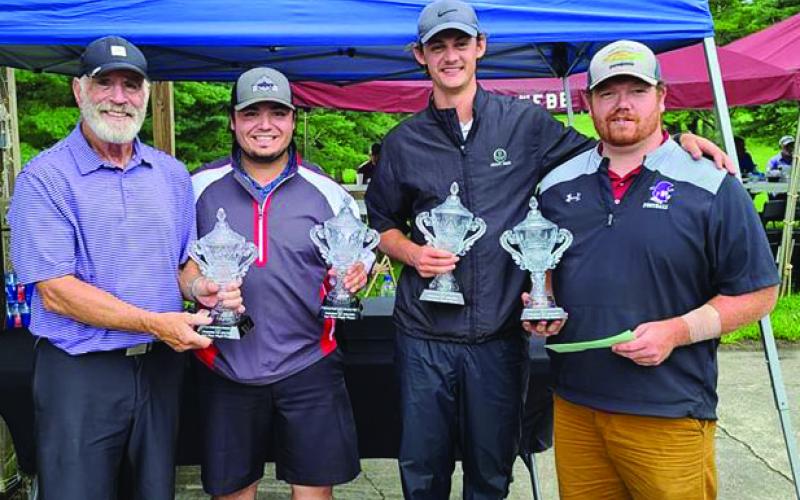 Billy Graham Evangelistic Association Executive Vice President Ken Karun with second flight tournament winners Greyson Stafford, Drey Phillips and Jamison Burleson. Not pictured is Austin Mask. (Photo by Rocky Branch)