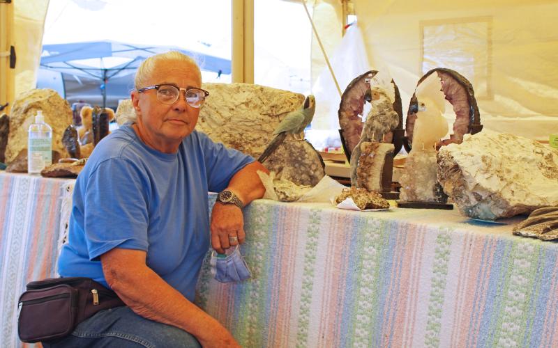 Mitchell County resident and Rocks and Things owner Mabel Benjamin poses for a photo Friday, July 31 in her booth at the Grassy Creek Gem and Mineral Show. The show proceeded despite the ongoing pandemic by utilizing health and safety precautions. (MNJ photo/Juliana Walker)