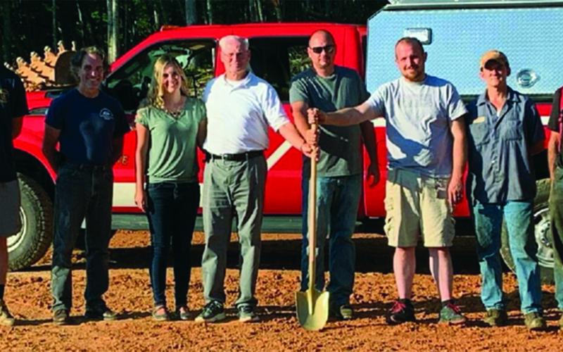 Volunteers pose for a photo. before beginning work on a new substation for the rural Rhododendron Fire District. Bakersville Fire and Rescue started construction on the substation earlier this month. The substation will allow the department to provide continued protection to the Bandana community. (Photo submitted)