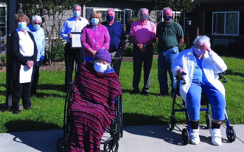 Mitchell House residents Ruth Archer (102) and Mabel Elberta Wing (99) (front) were honored by the High Country Area Agency on Aging during a special ceremony on Monday, Sept. 21. In the back, from the left, celebrating with the duo is Norma Duncan, Charles Duncan, Tim Greene, Darla Harding, Richard Canipe, Charles Vines and Jeff Harding. (Submitted photo)