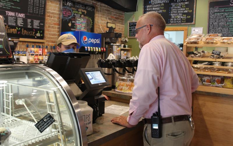 Spruce Pine Police Chief Bill Summerlin places his lunch order at DT’s Blue Ridge Java on Friday, Sept. 11. Local law enforcement officers were provided free meals at DT’s during the day courtesy of Sweet Creek Construction. Summerlin said the gesture means a lot to him. (MNJ photo/Juliana Walker)