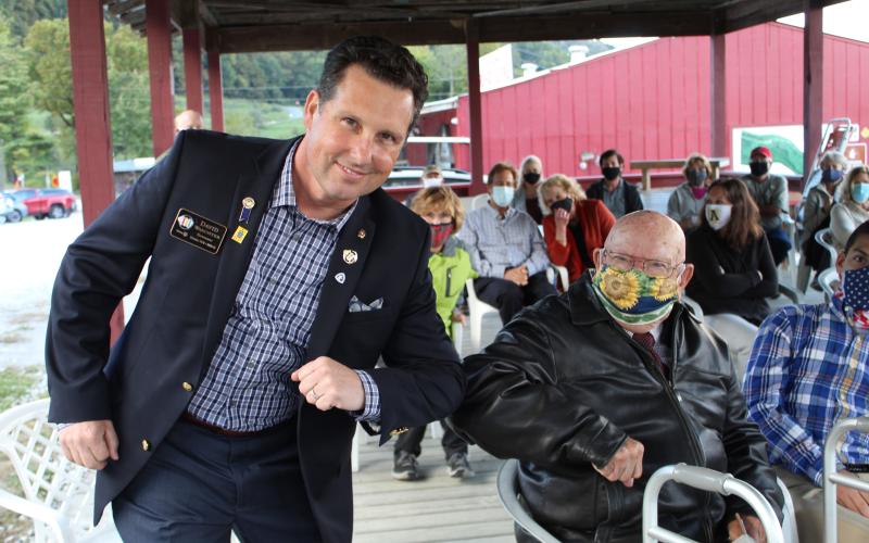 District Governor David Waechter elbow bumps with four-time Paul Harris Fellow Rotarian Calvin Hall. Hall contributed a fellowship to his three children.  (MNJ photo/Juliana Walker)