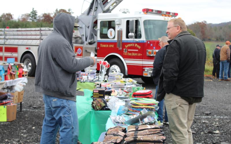 A vendor speaks with a possible customer at Remember When Day on Oct. 31. The festival featured vendors, food, live music and antique tractors, cars and trucks. (MNJ Photo/Juliana Walker)