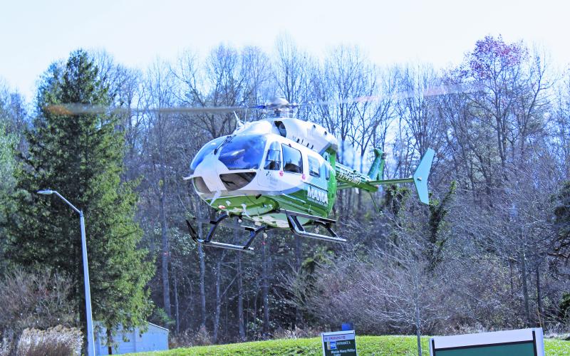 Mission Health’s new Mountain Area Medical Airlift (MAMA) craft makes its first descent into Spruce Pine on Tuesday, Nov. 17 at Blue Ridge Regional Hospital. The new craft, an EC-145e, will increase safety margins across all mission profiles and will increase the patient care area by 31 percent. (MNJ photo/Cory Spiers)
