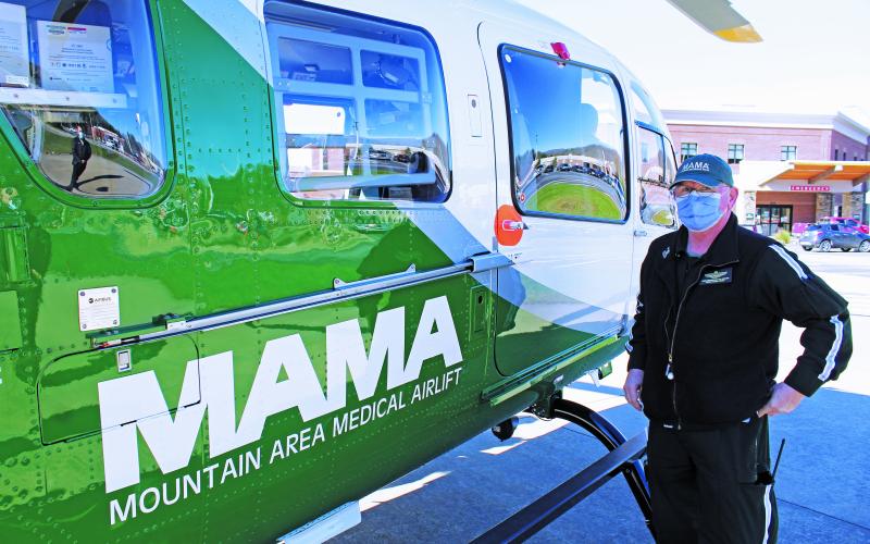 Mountain Area Medical Airlift (MAMA) Supervisor John Grindstaff stands next to the new aircraft and talks about the benefits it will bring to Mission Health and the local communities it serves. (MNJ photo/Cory Spiers)