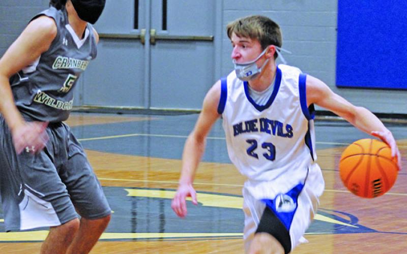 Ian Ledford (23) looks for space as he prepares to drive the paint during a home game against Cranberry earlier this month. Ledford scored a team-high 15 points in the team’s win over Cranberry. The Harris boys also put together double-digit wins over Avery, East Yancey and Bowman earlier this month. (Photo courtesy of Harris Middle School/Stephanie Warren)