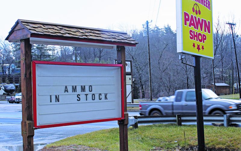 The billboard in front of Mountaineer Pawn advertises a very hot item. (MNJ photo/Cory Spiers)