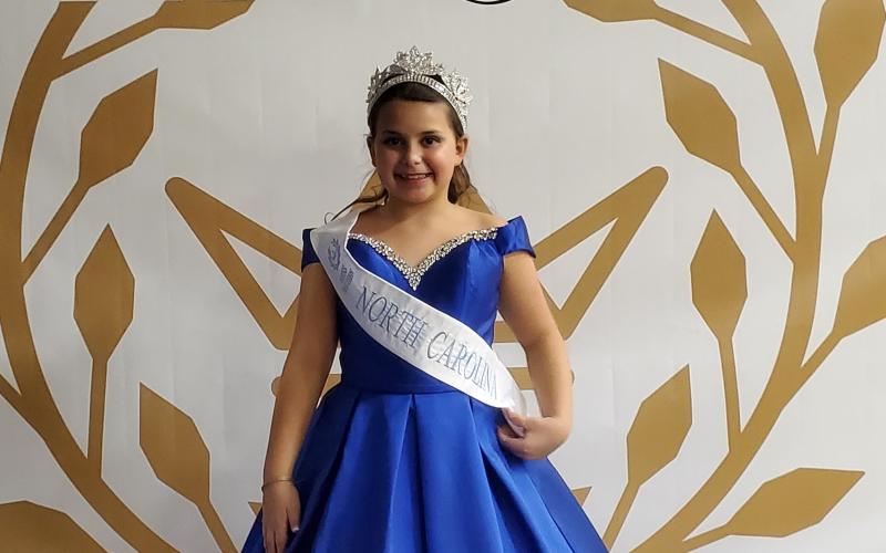Katelynn Sillman poses for a photo while wearing her pageant attire. Sillman, 10, was crowned Miss Pre-Teen North Carolina earleir this month and received a sash and crown. (Submitted photo)
