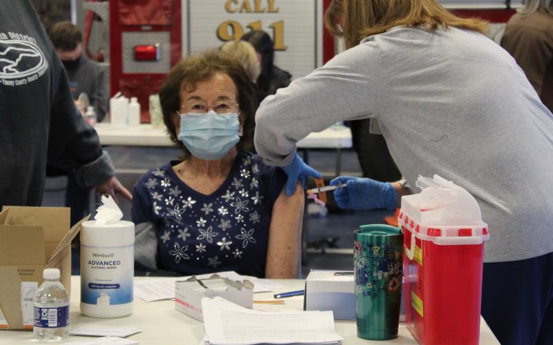 Patsy Covington, 83, excitedly receives her vaccine in the garage area of the fire department on Thursday, Jan. 14. “I’m tired of all of this uncertainty of whether or not I’m going to get this virus,” Covington said. (MNJ Photo/Juliana Walker)