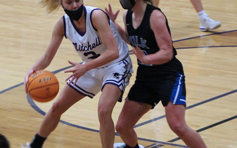 Mitchell senior Paige Johnson backs down a Polk defender on Friday, Feb. 12 during a home game in Ledger. Johnson scored 11 points and helped the Mountaineers win the game 62-41 to move to 12-0 on the season. (MNJ photo/Cory Spiers)