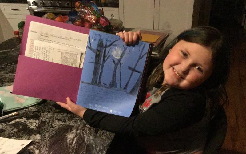 Emery Newton, a student in Michelle Stafford’s third-grade class at Deyton, shows off her first entry in her moon journal. The moon journal project took on a new virtual format this year. (Submitted)