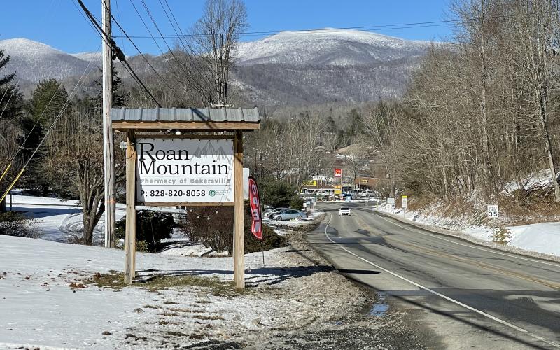 The new Roan Mountain Pharmacy of Bakersville opened its doors earlier this month. The sign that sits at the entrance of the pharmacy, just outside of downtown Bakersville, sits ready to attract visitors on a cold, snowy February day. (MNJ photo/Juliana Walker)