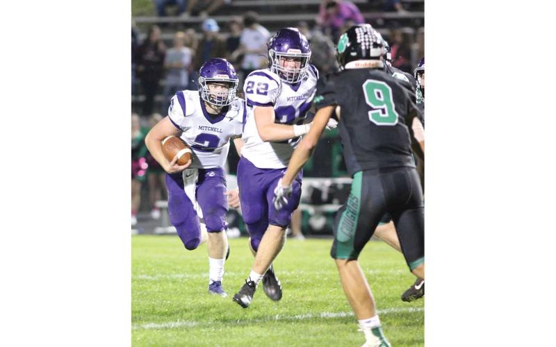 The only obstacle between Mitchell wide receiver Gabe Brandt (2) and a Cougar lineman is teammate Carter Holye (22).  (MNJ photos)
