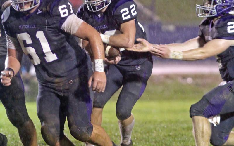 Senior running back Carter Hoyle (22) takes the hand-off and follows his lead blocker, junior Chandler Horney (61). (MNJ photos)