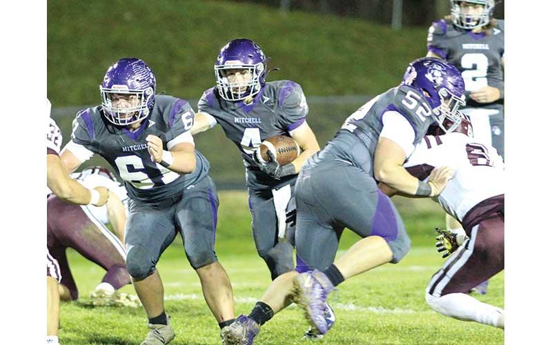 Sophomore Chase Duncan (4) looks for running room as juniors Chandler Horney (61) and Nate Stamey (52) attempt to open up a hole during a playoff win over visiting Swain. (MNJ photo/Cory Spiers)