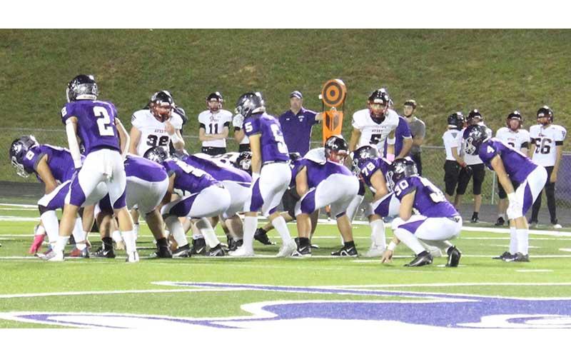 MNJ photo/Macie Greene - Mountaineer quarterback Caleb Cook (5) waits for the snap during Friday night’s game against Avery.