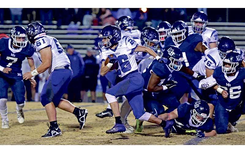 MNJ photo/Cory Smith - Lineman Sage Biddix (51) clears a path for running back Cole Young (26)