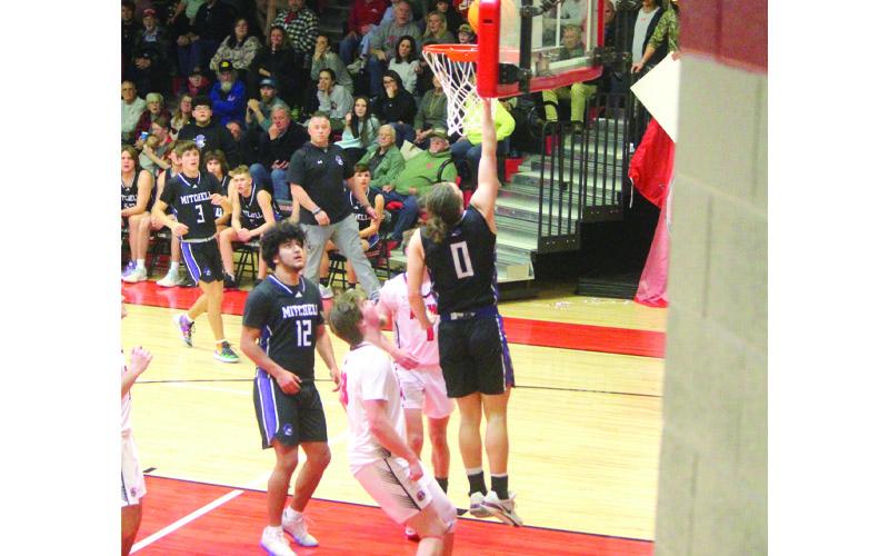 Photo/Stephanie Warren. #0 Dillon Barnett elevates for the layup.