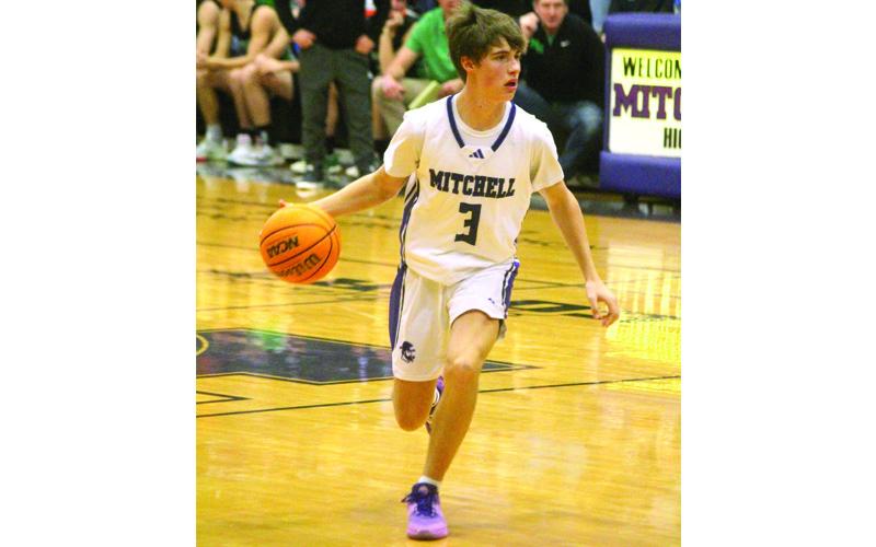 Photo/Stephanie Warren.  Connor Warren brings the ball upcourt.