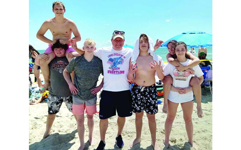 Photo submitted. Several Western Carolina Wrestling Club wrestlers and Coach Duncan pause for a photo during Carolina Beach Nationals.