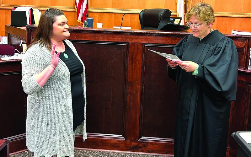 Photo submitted. District Court Judge Rebecca Eggers-Gryder, right, swears in Mitchell County’s newest Guardian ad Litem, Megan Hicks, in the Mitchell County Courtroom.