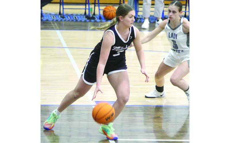 Photos/Stephanie Warren. Piper Cook drives for a basket in a Mitchell High School versus Unicoi County High School game.