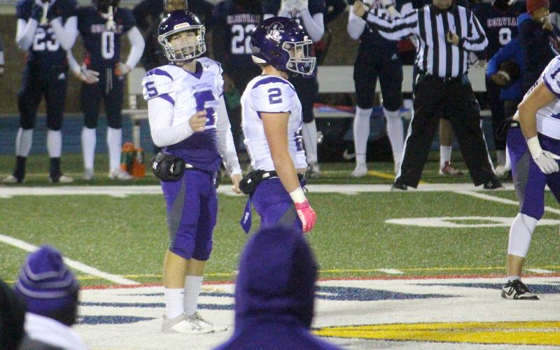 Special to MNJ/Stephanie Warren.  Caleb Cook waits for the play call from the sideline. Cook and the Mountaineers lost their playoff game to Corvian Community High School 42-6.