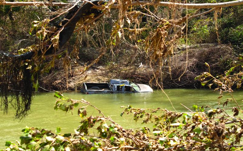 MNJ photo/Sarah Atkins.  Rising waters moved cars, and even homes, down the rushing North Toe River during Hurricane Helene.