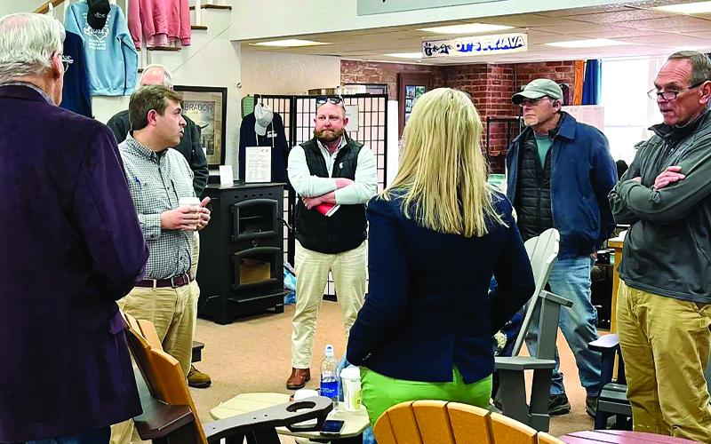 Submitted photo.  North Carolina Labor Commissioner Luke Farley, second from left, visits with local business owners at DT’s Junior Java.