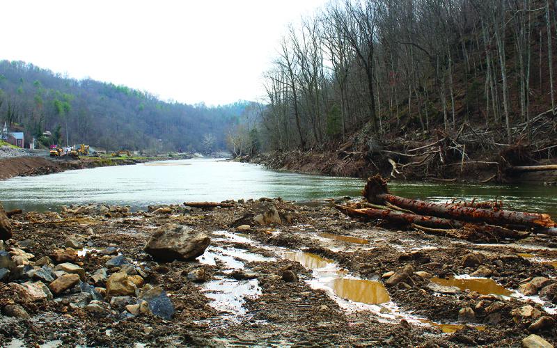 MNJ Photo/Mariel Williams.  Many Mitchell County waterways have excess flood debris on banks and stream beds. County residents can now apply for waterway and private property debris removal by calling the Helene Hotline at (828) 537-1441.