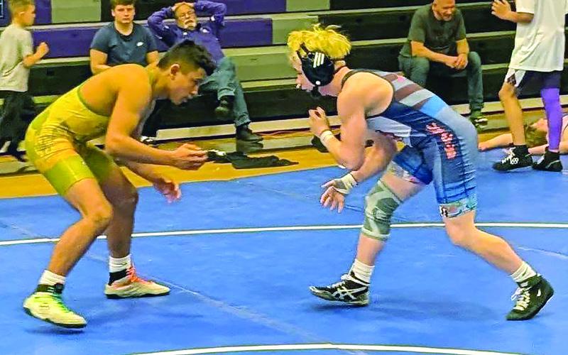Submitted photos.  Bryson McFalls, first place in Junior Boys 132-138, wrestles against an Alleghany opponent.