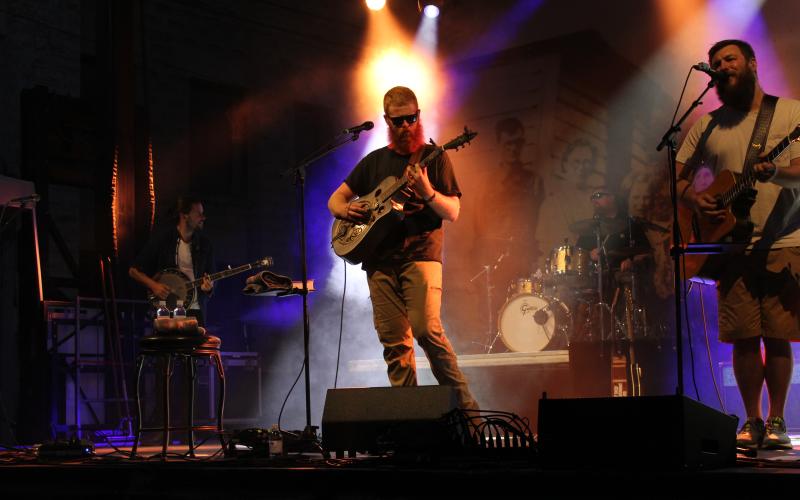 MNJ Photos/Mariel Williams.  Oliver Anthony Music performs for a sold-out crowd on Lower Street (Locust Avenue). The Saturday concert was organized as a fundraiser for the recovery effort from Hurricane Helene, and organizers said they sold 3,000 tickets.