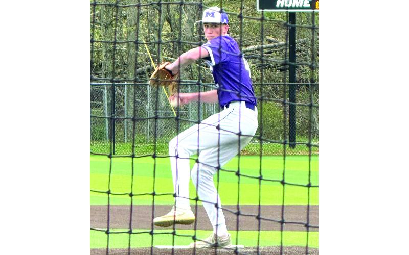 Submitted photo.  Riley Silvers winds up a pitch for the Mitchell High School Mountaineers.